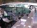 1978 Ford Bronco - The engine bay of a vehicle shows exposed wiring and painted firewall components.