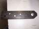 1991 Ford Bronco - A fabricated metal part, possibly a bracket or linkage, with four drilled holes and a tapered end is shown.