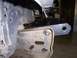 1991 Ford Bronco - A custom metal bracket is bolted to the chassis of a vehicle, likely for bumper modification.