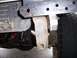 1991 Ford Bronco - Close-up view of custom front bumper fabrication, showing mounting brackets, radiator, and tire.