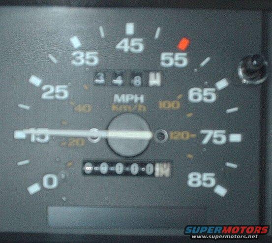 Vehicle dashboard gauge cluster showing a speedometer reading 55 mph and an odometer reading 000001