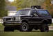 1995 Ford Bronco - Rhino Lined, Buswackers, teflon painted wheels