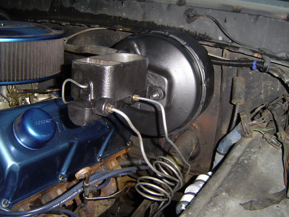 brake booster and master cylinder assembly with brake lines coiled
