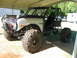 1992 Ford Mustang - This heavily modified Ford Bronco features a roll cage and oversized tires, suggesting it's built for off-road use.