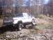 1990 Ford Ranger - Lifted 1990 Ford Ranger navigates a rocky, off-road trail during autumn.