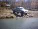 1990 Ford Ranger - Lifted 1990 Ford Ranger parked on a rocky bank by the water.