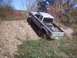 1990 Ford Ranger - This lifted 1990 Ford Ranger navigates a steep dirt embankment, its off-road capabilities.