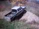 1990 Ford Ranger - Silver 1990 Ford Ranger pickup truck equipped for off-roading on a gravel hill.