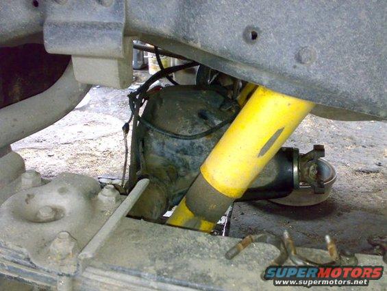 Rear axle assembly with yellow shock absorber and leaf springs