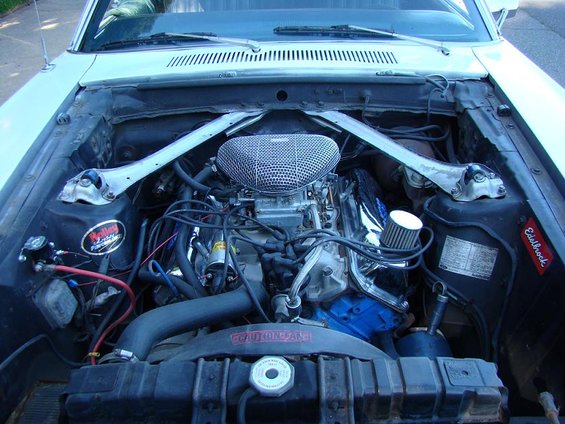1970 Mercury Cougar engine bay with a V8 engine, chrome air cleaner, and Edelbrock sticker