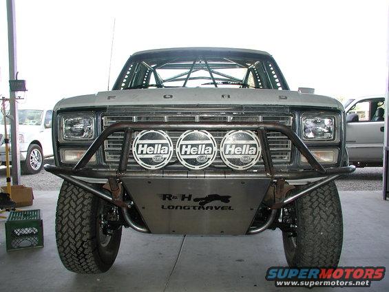 1980 Ford Bronco front view with custom bumper, Hella lights, and roll cage
