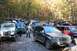 1992 Jeep Cherokee - Multiple Jeeps are gathered in a wooded area during the fall.