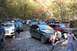 1992 Jeep Cherokee - A group of Jeeps and people gather in a wooded area during the autumn season.