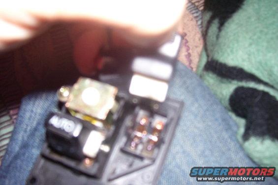 Power window switch with 'AUTO' label