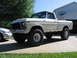1979 Ford F-150 - This lifted 1979 Ford F-150 pickup truck is shown in a 3q-front view, parked in a driveway.