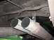 1979 Ford F-150 - Underside view of dual exhaust pipes and chassis components.