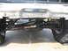 1979 Ford F-150 - The front suspension and steering components of a truck are visible, with a Rancho steering stabilizer installed.