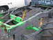 1979 Ford F-150 - The frame and suspension components of a truck are visible, painted green and black with yellow shocks.