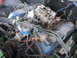 1979 Ford F-150 - Engine bay detail showing a Ford V8 motor with blue valve covers and associated wiring.