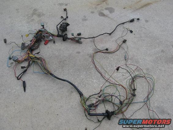 Vehicle wiring harness spread out on concrete ground
