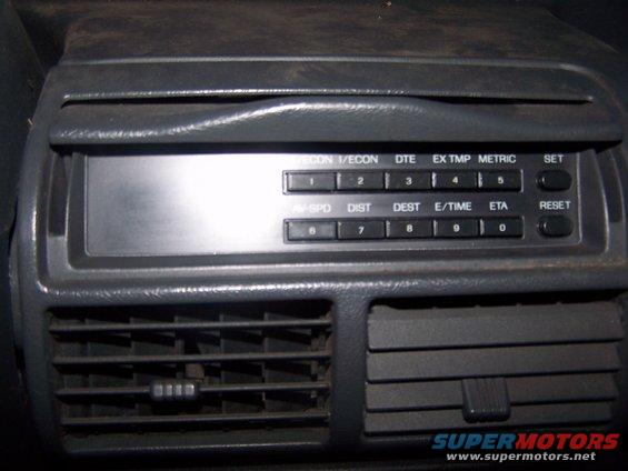 Car interior climate control panel with digital display and air vents