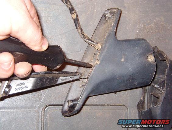 04headscrews.jpg Remove the 2 T-25 screws from the bottom of the mirror base.  The outer screw is accessible while the mirror is installed on the truck, but removing it before this step is pointless.