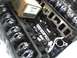1991 Ford Mustang - Close-up view of engine components, including an intake manifold and rocker arms, with a box bearing Ford branding visible.