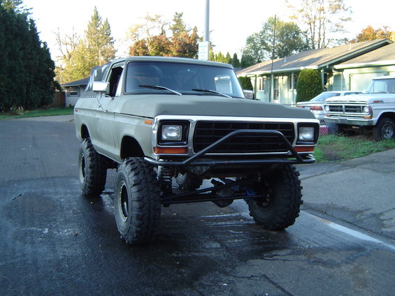 1978 Ford Bronco modified with large off-road tires and a custom front bumper