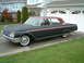 1962 Ford Galaxie - A 1962 Ford Galaxie 500 with a matte black finish and red roof is parked in a driveway.