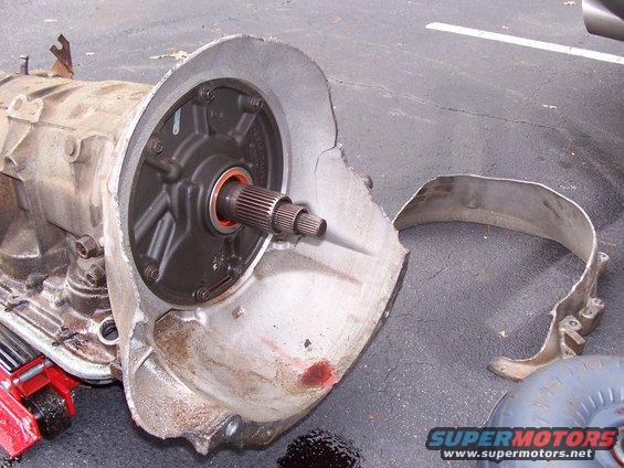 Damaged automatic transmission with a cracked bell housing and exposed torque converter splines