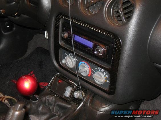 2002 Pontiac Trans Am interior with aftermarket stereo and carbon fiber trim