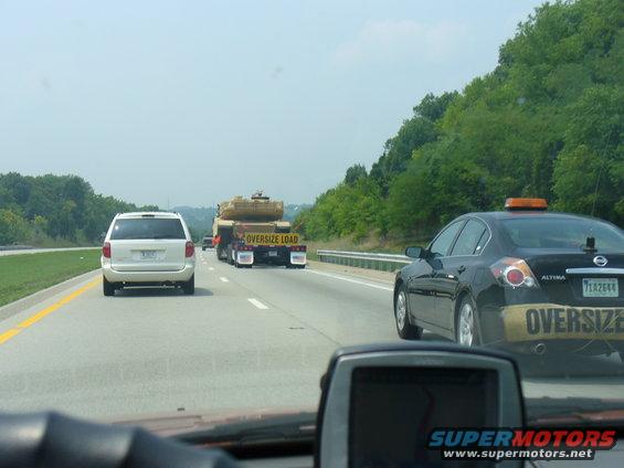 Oversize load on flatbed truck, seen from behind