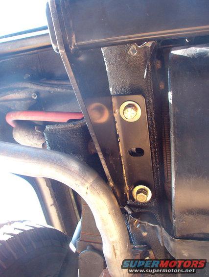 03lframehorn.jpg The receiver is hung loosely and pulled as far rearward as possible (so it can't shift later) before the front & rear bolts are tightened.