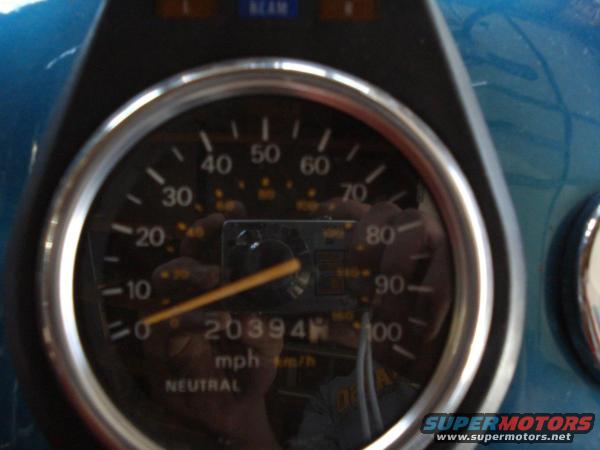 Speedometer gauge with needle pointing to 0, showing 20394 miles