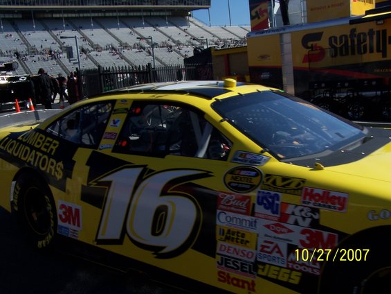 Yellow and black NASCAR race car with number 16 and sponsor decals. Date 10/27/2007 visible