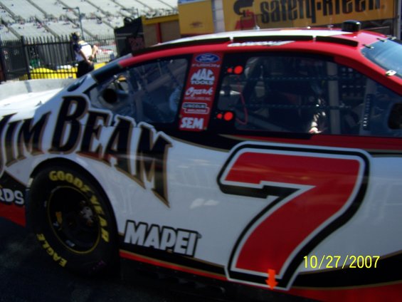 Race car with "Jim Beam" and "7" logos, parked at a track