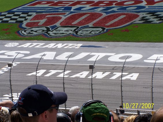 Race track with 'Pep Boys 500 Atlanta' painted on it, viewed from above