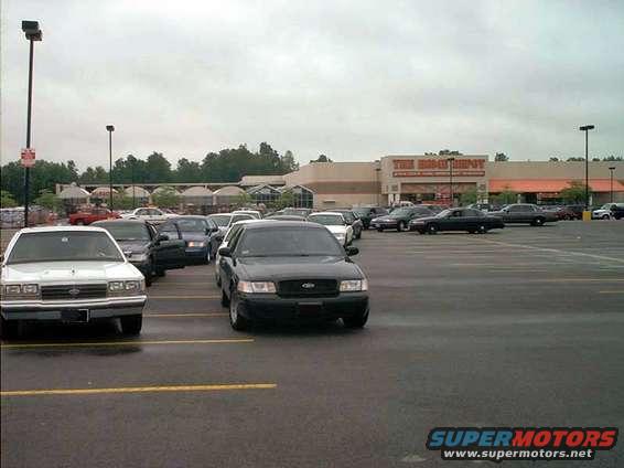 Black 2000 Ford Crown Victoria parked in a lot