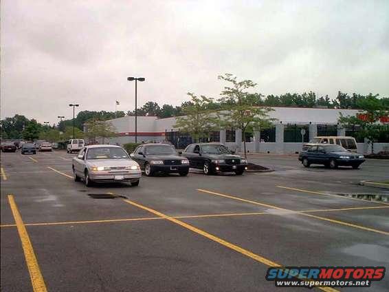 Silver 2000 Ford Crown Victoria parked in a lot with other cars