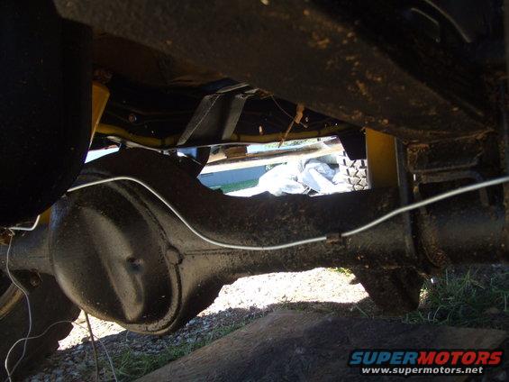 Undercarriage view of vehicle rear differential and suspension