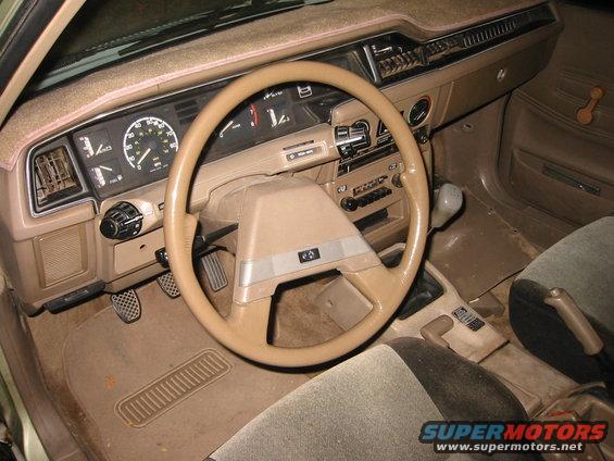 img_0085.jpg Three pedals, two bands on the radio, and a steering wheel.  Pods for the lights and wipers are the greatest things ever.  Reminds me quite a bit of Citroens (particularly the Visa) of the same time, oddly enough.