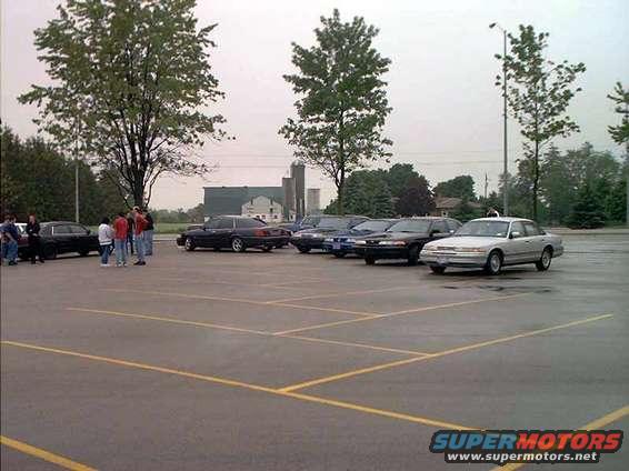 Silver sedan parked in a lot, 1998 model year suggested by body style