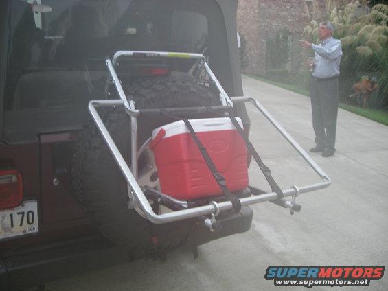 Jeep Wrangler rear with spare tire carrier and red cooler