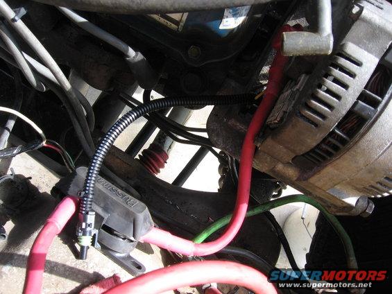 Alternator and wiring in engine bay. Visible text: 'Bussmann'