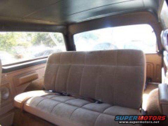 Interior view of 1986 Ford Bronco showing bench seat and windows