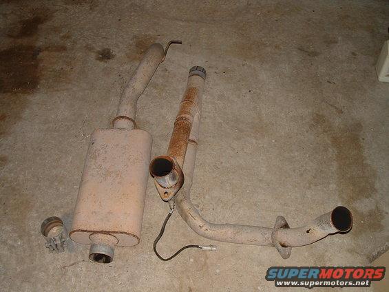 Exhaust system parts on concrete floor