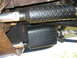 1992 Ford Mustang - The underside of a vehicle shows two exhaust pipes covered in black diamond plate material.
