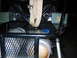 1992 Ford Mustang - The interior of a custom vehicle shows two seats, storage boxes, and safety straps.
