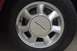 1995 Ford Thunderbird - Close-up of a silver wheel the Thunderbird emblem, consistent with a 1995 Ford Thunderbird.