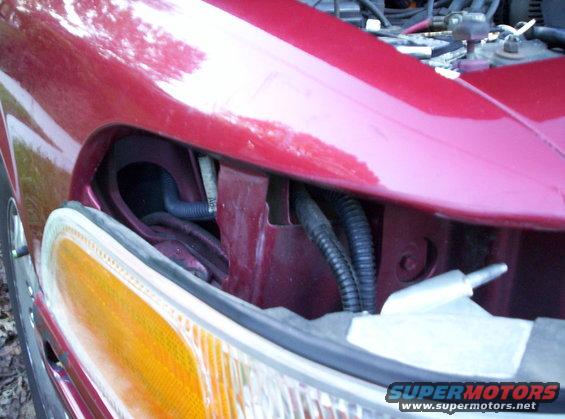 headlight-relay-install-pics-005.jpg Wire behind battery then down behind corner lamp